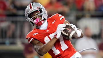 Ohio State Buckeyes wide receiver Carnell Tate (17) catches a touchdown pass during the first half of the NCAA football game against the Minnesota Golden Gophers at Ohio Stadium in Columbus on Oct. 4, 2025.