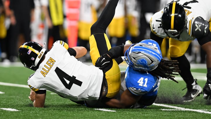 Aug 24, 2024; Detroit, Michigan, USA; Pittsburgh Steelers quarterback Kyle Allen (4) is sacked by Detroit Lions linebacker James Houston (41) in the second quarter at Ford Field. Mandatory Credit: Lon Horwedel-USA TODAY Sports