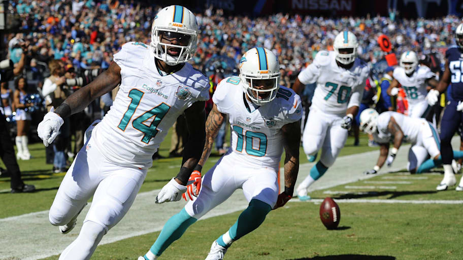 Miami Dolphins receiver Jarvis Landry (14) celebrates after scoring a touchdown during the first half against the Tennessee Titans at Nissan Stadium in 2015. | Christopher Hanewinckel-Imagn Images