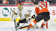 Oct 2, 2023; Philadelphia, Pennsylvania, USA; Boston Bruins goaltender Jeremy Swayman (1) makes a save against Philadelphia Flyers center Morgan Frost (48) during the second period at Wells Fargo Center. Mandatory Credit: Eric Hartline-Imagn Images
