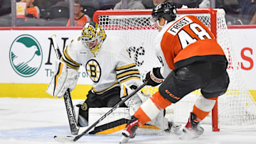 Oct 2, 2023; Philadelphia, Pennsylvania, USA; Boston Bruins goaltender Jeremy Swayman (1) makes a save against Philadelphia Flyers center Morgan Frost (48) during the second period at Wells Fargo Center. Mandatory Credit: Eric Hartline-Imagn Images