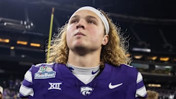 Dec 26, 2024; Phoenix, AZ, USA; Kansas State Wildcats quarterback Avery Johnson (2) against the Rutgers Scarlet Knights during the Rate Bowl at Chase Field. Mandatory Credit: Mark J. Rebilas-Imagn Images