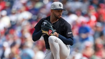 Mar 4, 2025; Clearwater, Florida, USA; New York Yankees pitcher Devin Williams (38) throws a pitch against the Philadelphia Phillies in the fourth inning during spring training at BayCare Ballpark.