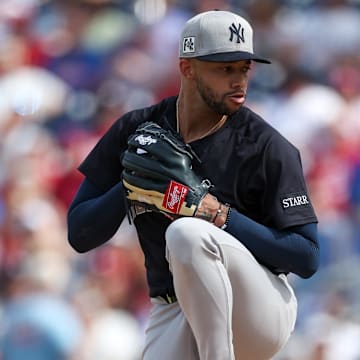 Mar 4, 2025; Clearwater, Florida, USA; New York Yankees pitcher Devin Williams (38) throws a pitch against the Philadelphia Phillies in the fourth inning during spring training at BayCare Ballpark.