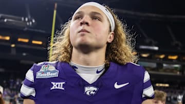 Dec 26, 2024; Phoenix, AZ, USA; Kansas State Wildcats quarterback Avery Johnson (2) against the Rutgers Scarlet Knights during the Rate Bowl at Chase Field. Mandatory Credit: Mark J. Rebilas-Imagn Images