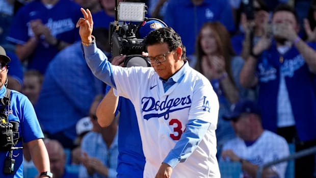 Former Dodgers pitcher Fernando Valenzuela waves to the crowd before throwing the first pitch of the 2022 MLB All-Star Game.