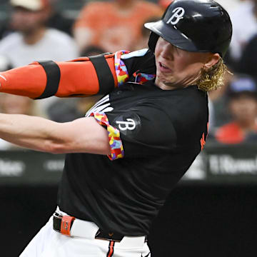 Jul 12, 2024; Baltimore, Maryland, USA; Baltimore Orioles outfielder Heston Kjerstad (13) swings through a second inning single against the New York Yankees  at Oriole Park at Camden Yards. 