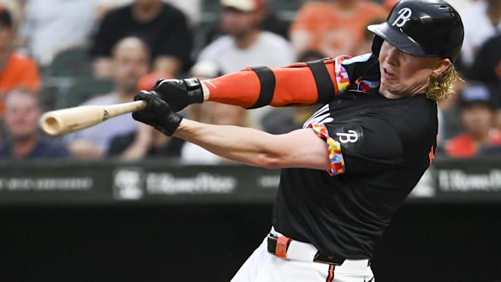 Jul 12, 2024; Baltimore, Maryland, USA; Baltimore Orioles outfielder Heston Kjerstad (13) swings through a second inning single against the New York Yankees  at Oriole Park at Camden Yards. 