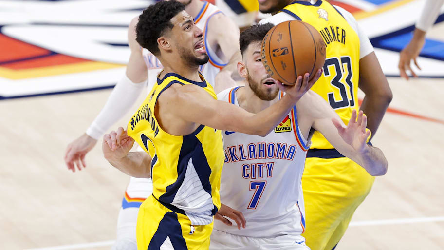Indiana Pacers guard Tyrese Haliburton drives to the basket past Oklahoma City Thunder forward Chet Holmgren. | Alonzo Adams-Imagn Images