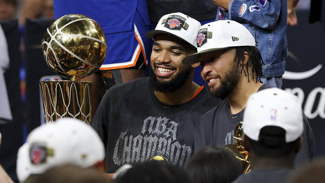 Jun 13, 2026; San Antonio, Texas, USA; New York Knicks center Karl-Anthony Towns (32) and guard Jalen Brunson (11) celebrates with his teammates after the Knicks defeat the San Antonio Spurs during Game 5 of the 2026 NBA Finals at Frost Bank Center.