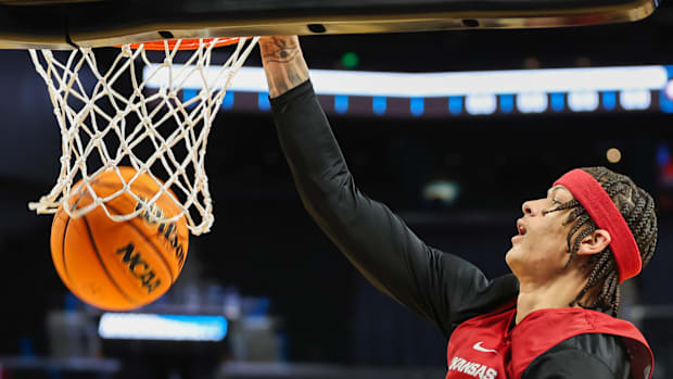 Razorbacks forward Trevon Brazile dunks during practice at the Chase Center