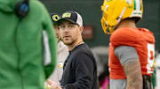 Oregon offensive coordinator and quarterbacks coach Will Stein works with the team as the Oregon Ducks practice ahead of the Rose Bowl Friday, Dec. 27, 2024, at the Moshofsky Center in Eugene, Ore.