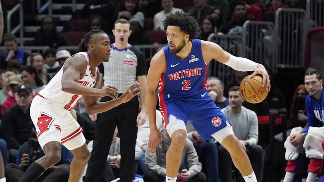 Feb 11, 2025; Chicago, Illinois, USA; Chicago Bulls guard Ayo Dosunmu (11) defends Detroit Pistons guard Cade Cunningham (2) during the first quarter at United Center. Mandatory Credit: David Banks-Imagn Images