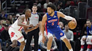 Feb 11, 2025; Chicago, Illinois, USA; Chicago Bulls guard Ayo Dosunmu (11) defends Detroit Pistons guard Cade Cunningham (2) during the first quarter at United Center. Mandatory Credit: David Banks-Imagn Images