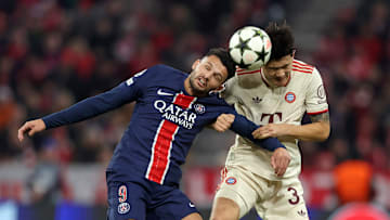 Kim Min Jae winning an aerial duel against Goncalo Ramos of PSG 