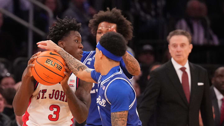 Mar 13, 2026; New York, NY, USA;  Seton Hall Pirates defense smothers St. John's basketball guard Joson Sanon (3) during the second half at Madison Square Garden.