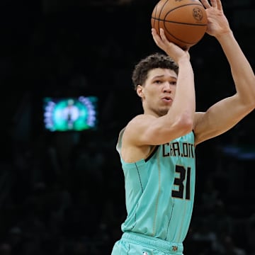 Apr 13, 2025; Boston, Massachusetts, USA; Charlotte Hornets forward Tidjane Salaun (31) shoots during the second half against the Boston Celtics at TD Garden. Mandatory Credit: Paul Rutherford-Imagn Images