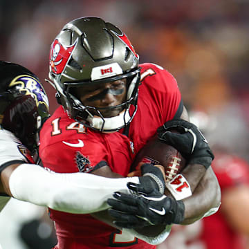 Tampa Bay Buccaneers wide receiver Chris Godwin is pressured by Baltimore Ravens cornerback Marlon Humphrey.