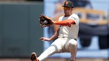 Jun 22, 2025; San Francisco, California, USA; San Francisco Giants third baseman Casey Schmitt (10) falls backward fielding a sharp infield hit by Boston Red Sox third baseman Nate Eaton during the second inning at Oracle Park.