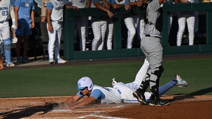 May 29, 2026; Chapel Hill, NC, USA; North Carolina Tar Heels utility Erik Paulsen (44) slides into the plate for a run during game 2 of the Chapel Hill Regional at Boshamer Stadium. Mandatory Credit: William Howard-Imagn Images