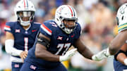 Nov 22, 2025; Tucson, Arizona, USA; Arizona Wildcats offensive lineman Michael Wooten (77) against the Baylor Bears at Casino Del Sol Stadium. Mandatory Credit: Mark J. Rebilas-Imagn Images