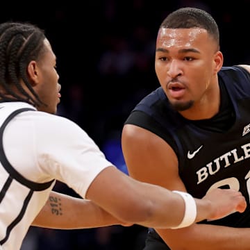 Mar 12, 2025; New York, NY, USA; Butler Bulldogs forward Pierre Brooks II (21) controls the ball against Providence Friars forward Rich Barron (10) during the first half at Madison Square Garden. Mandatory Credit: Brad Penner-Imagn Images