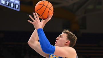 Dec 3, 2025; Seattle, Washington, USA; UCLA Bruins forward Tyler Bilodeau (34) shoots the ball against the Washington Huskies during the second half at Alaska Airlines Arena at Hec Edmundson Pavilion. Mandatory Credit: Steven Bisig-Imagn Images