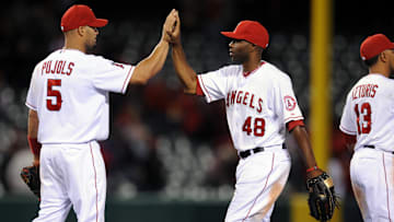 Angels first baseman Albert Pujols (5) celebrates with right fielder Torii Hunter (48) after the game against the Oakland Athletics at the Angel Stadium of Anaheim on April 16, 2012.