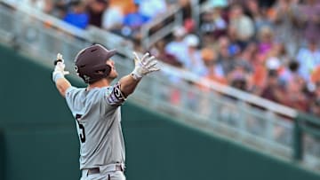 Jun 22, 2024; Omaha, NE, USA;  Texas A&M Aggies designated hitter Hayden Schott (5) reacts after hitting a double against the Tennessee Volunteers during the fourth inning at Charles Schwab Field Omaha. Mandatory Credit: Steven Branscombe-Imagn Images