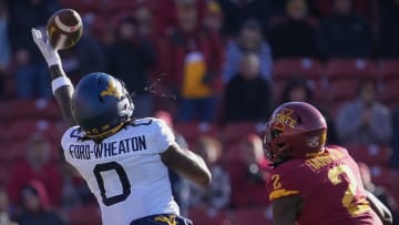 West Virginia wide receiver Bryce Ford-Wheaton (0) spits toward Iowa State defensive back T.J. Tampa (2) as he reaches for a pass in the third quarter during a NCAA football game at Jack Trice Stadium in Ames on Saturday, Nov. 5, 2022.

Iowastatevswvu 202201105 Bh