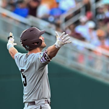 Jun 22, 2024; Omaha, NE, USA;  Texas A&M Aggies designated hitter Hayden Schott (5) reacts after hitting a double against the Tennessee Volunteers during the fourth inning at Charles Schwab Field Omaha. Mandatory Credit: Steven Branscombe-Imagn Images