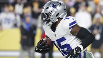 Oct 6, 2024; Pittsburgh, Pennsylvania, USA;  Dallas Cowboys running back Ezekiel Elliott (15) runs the ball against the Pittsburgh Steelers during the fourth quarter at Acrisure Stadium. Dallas won 20-17. Mandatory Credit: Charles LeClaire-Imagn Images