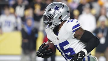 Oct 6, 2024; Pittsburgh, Pennsylvania, USA;  Dallas Cowboys running back Ezekiel Elliott (15) runs the ball against the Pittsburgh Steelers during the fourth quarter at Acrisure Stadium. Dallas won 20-17. Mandatory Credit: Charles LeClaire-Imagn Images