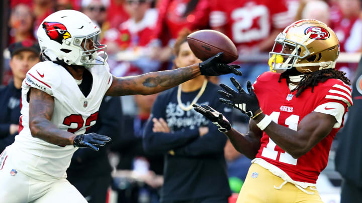 Dec 17, 2023; Glendale, Arizona, USA; Arizona Cardinals cornerback Antonio Hamilton Sr. (33) breaks up a pass intended for San Francisco 49ers wide receiver Brandon Aiyuk (11) during the first quarter at State Farm Stadium. Mandatory Credit: Mark J. Rebilas-USA TODAY Sports