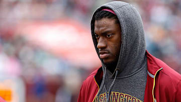 Oct 4, 2015; Landover, MD, USA; Washington Redskins quarterback Robert Griffin III stands the bench against the Philadelphia Eagles at FedEx Field. Mandatory Credit: Geoff Burke-Imagn Images