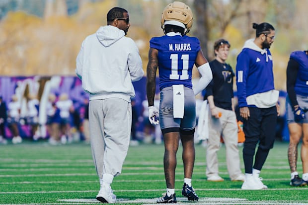 Kevin Cummings and Marcus Harris share a UW spring ball moment. 