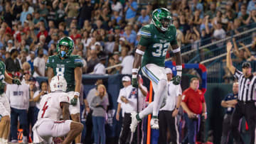 Sep 2, 2023; New Orleans, Louisiana, USA;  Tulane Green Wave safety Bailey Despanie (32) reacts to making a tackle against South Alabama Jaguars wide receiver Caullin Lacy (4) during the first half at Yulman Stadium. 