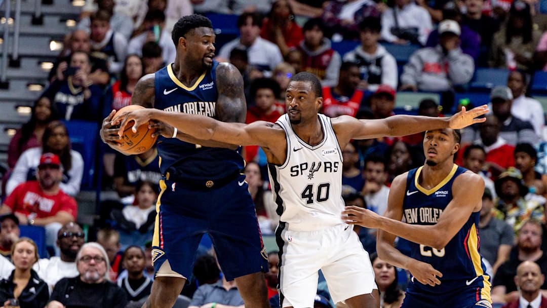 Oct 24, 2025; New Orleans, Louisiana, USA;  San Antonio Spurs forward Harrison Barnes (40) reaches to steal the ball from New Orleans Pelicans forward Zion Williamson (1) during the second half at Smoothie King Center. Mandatory Credit: Stephen Lew-Imagn Images