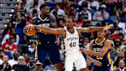 Oct 24, 2025; New Orleans, Louisiana, USA;  San Antonio Spurs forward Harrison Barnes (40) reaches to steal the ball from New Orleans Pelicans forward Zion Williamson (1) during the second half at Smoothie King Center. Mandatory Credit: Stephen Lew-Imagn Images