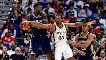 Oct 24, 2025; New Orleans, Louisiana, USA;  San Antonio Spurs forward Harrison Barnes (40) reaches to steal the ball from New Orleans Pelicans forward Zion Williamson (1) during the second half at Smoothie King Center. Mandatory Credit: Stephen Lew-Imagn Images