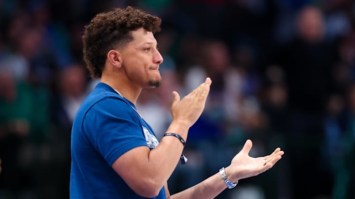 Kansas City Chiefs quarterback Patrick Mahomes cheers during the second half of the game between the Dallas Mavericks and Denver Nuggets.