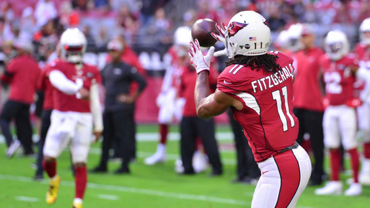 Dec 15, 2019; Glendale, AZ, USA; Arizona Cardinals wide receiver Larry Fitzgerald (11) catches a pass from quarterback Kyler Murray (1) prior to the game against the Cleveland Browns at State Farm Stadium. Mandatory Credit: Matt Kartozian-USA TODAY Sports