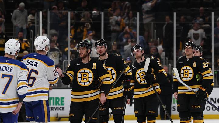 May 1, 2026; Boston, Massachusetts, USA; Boston right wing David Pastrnak (88) leads the Bruins as he shakes hands with Buffalo Sabres defenseman Rasmus Dahlin (26) after Game 6 of the first round of the 2026 Stanley Cup Playoffs at TD Garden.