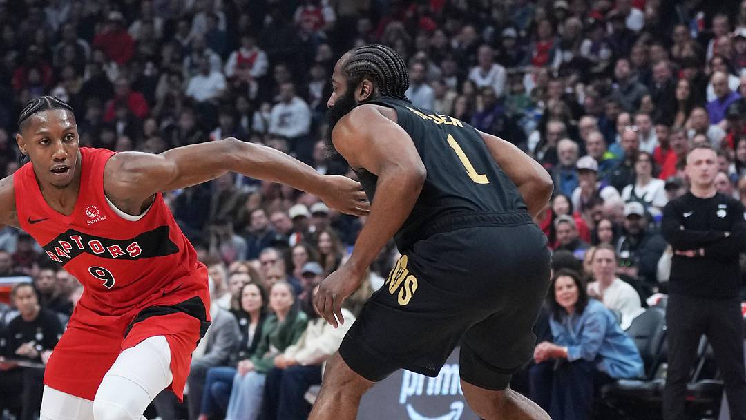 May 1, 2026; Toronto, Ontario, CAN; Toronto Raptors forward RJ Barrett (9) controls the ball as  Cleveland Cavaliers guard James Harden (1) tries to defend during the first quarter in game six of the first round of the 2026 NBA Playoffs at Scotiabank Arena. Mandatory Credit: Nick Turchiaro-Imagn Images