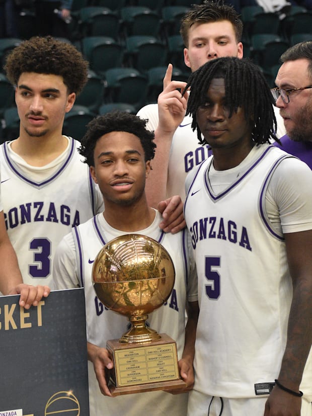 Gonzaga College poses with the 2024 Les Schwab Invitational trophy.