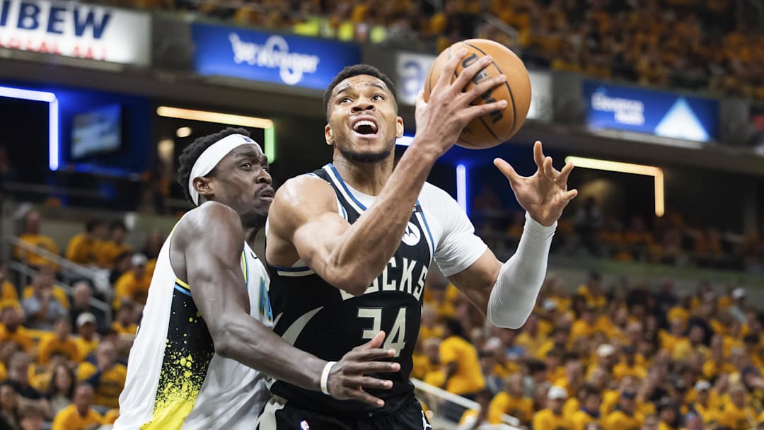 Apr 19, 2025; Indianapolis, Indiana, USA;  Milwaukee Bucks forward Giannis Antetokounmpo (34) shoots the ball while Indiana Pacers forward Pascal Siakam (43) defends in the first half at Gainbridge Fieldhouse. Mandatory Credit: Trevor Ruszkowski-Imagn Images