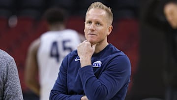 Mar 26, 2025; Newark, NJ, USA; Brigham Young Cougars head coach Kevin Young warms up during a practice session in preparation for an East Regional semifinal game against the Alabama Crimson Tide at Prudential Center. Mandatory Credit: Vincent Carchietta-Imagn Images