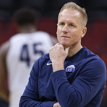 Mar 26, 2025; Newark, NJ, USA; Brigham Young Cougars head coach Kevin Young warms up during a practice session in preparation for an East Regional semifinal game against the Alabama Crimson Tide at Prudential Center. Mandatory Credit: Vincent Carchietta-Imagn Images