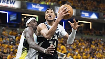 Apr 19, 2025; Indianapolis, Indiana, USA;  Milwaukee Bucks forward Giannis Antetokounmpo (34) shoots the ball while Indiana Pacers forward Pascal Siakam (43) defends in the first half at Gainbridge Fieldhouse. Mandatory Credit: Trevor Ruszkowski-Imagn Images
