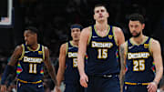 Mar 7, 2022; Denver, Colorado, USA; Denver Nuggets guard Austin Rivers (25) and center Nikola Jokic (15) and forward Aaron Gordon (50) and guard Monte Morris (11) during the fourth quarter at Ball Arena.